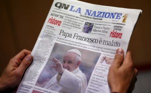 A man reads the Italian newspaper "Quotidiano Nazionale" in Rome