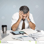 http://www.dreamstime.com/royalty-free-stock-photos-frustrated-man-worries-economy-unpaid-bills-image11756008